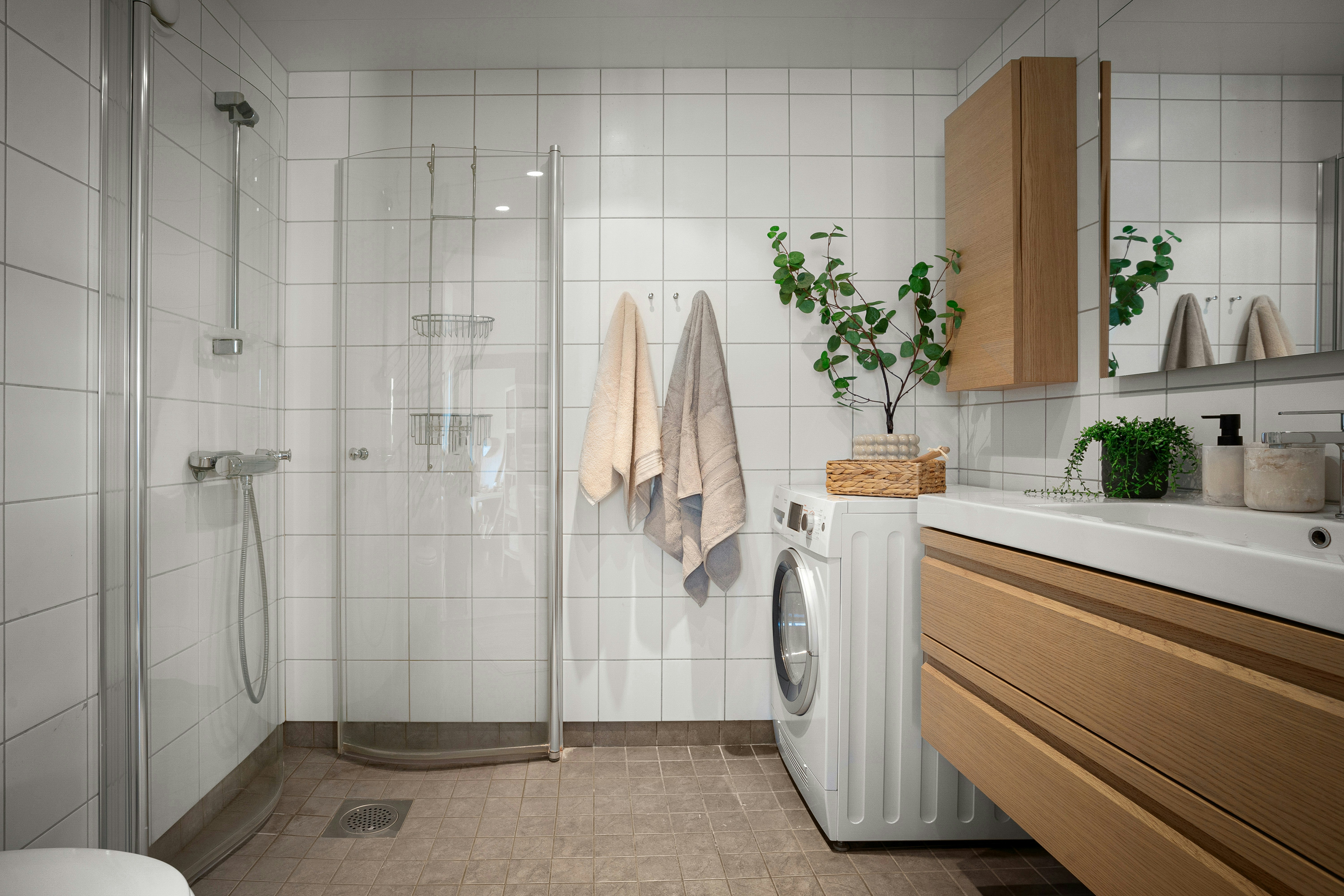 A bathroom with a washer and dryer in it